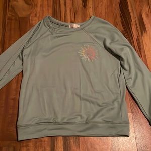 A long sleeve crewneck that has words on back, girls L, from chill collective.